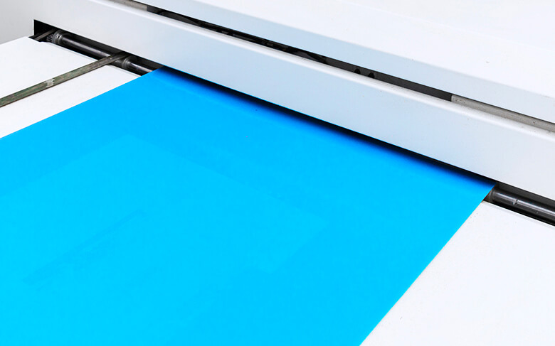 a plate for printing coming out from a laser plate making machine