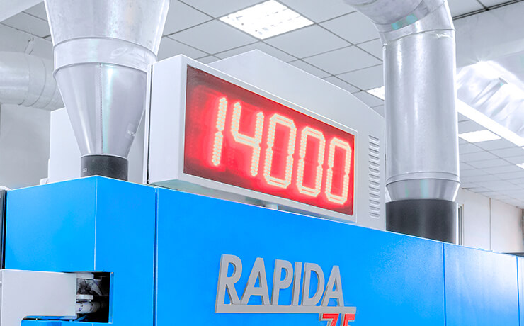 the LED screen of a printing machine showing 14000 rpm